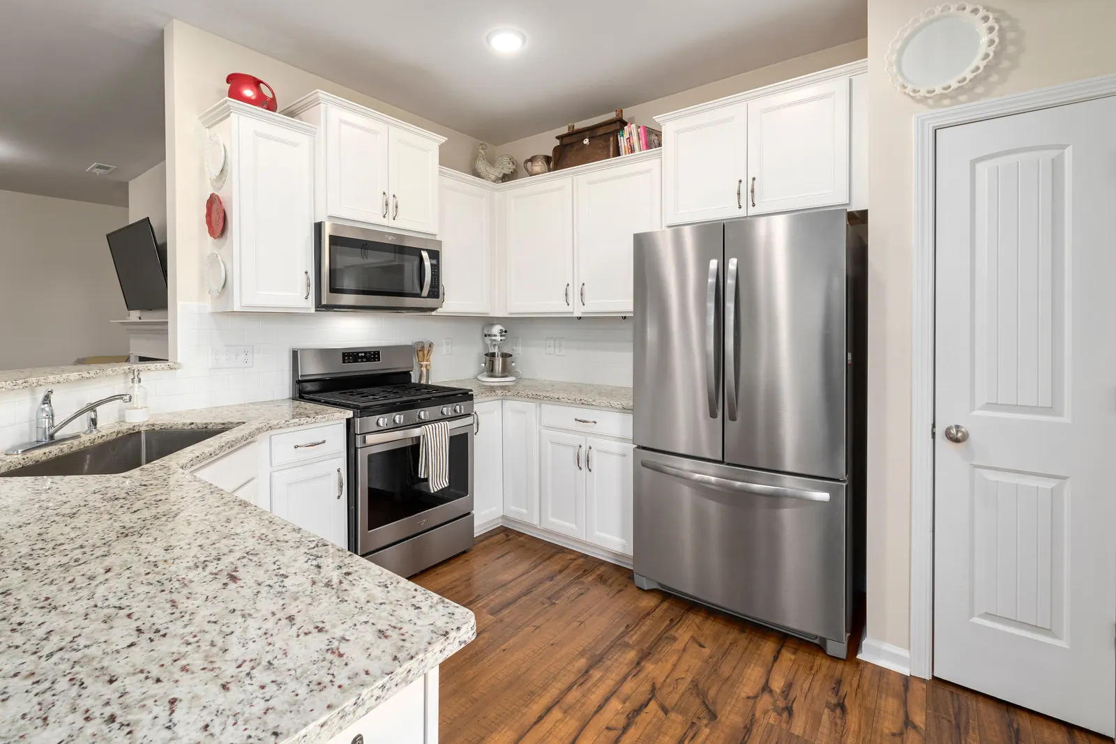 Household refrigerator in a bright kitchen